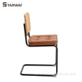 Cadeira de rattan moderna com perna de aço de almofada macia